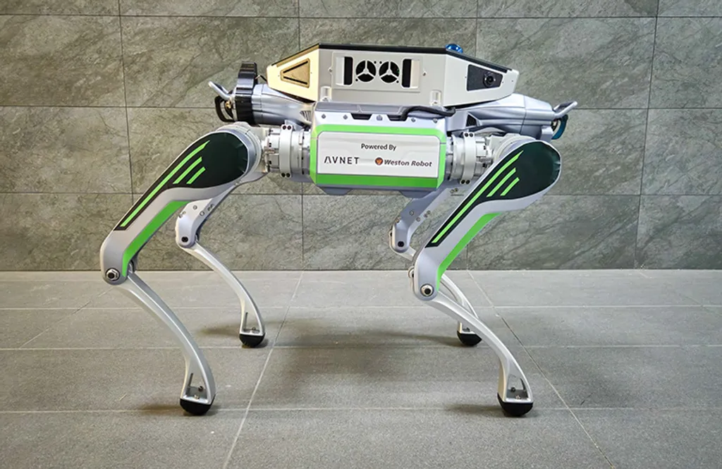 A four-legged Unitree-style quadruped robot standing on a gray tile floor against a stone-tile wall, with a boxy computing module mounted on its back bearing a plate labeled 'Powered By AVNET Weston Robot' in the Avnet and Weston Robot logos.