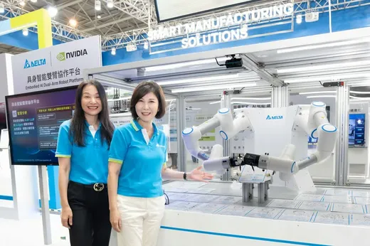 Two Delta Electronics executives in blue Delta-branded polo shirts stand beside the company's Embodied AI Dual-Arm Robot Platform display at Automation Taipei 2026, with a white dual-arm cobot and Delta and NVIDIA logos visible behind them.