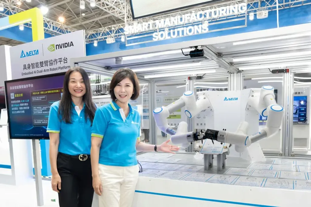Two Delta Electronics executives in blue Delta-branded polo shirts stand beside the company's Embodied AI Dual-Arm Robot Platform display at Automation Taipei 2026, with a white dual-arm cobot and Delta and NVIDIA logos visible behind them.