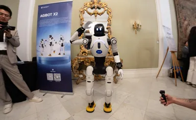 AGIBOT Debuts Four Robots at WAIC, Points to a Factory Deployment as Proof